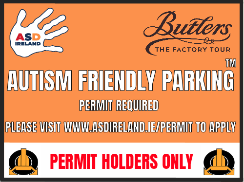 An orange autism friendly parking sign for ASD Ireland with the Butlers Factory Tour logo, showing that a permit is required and directing people to asdireland.ie/permit.